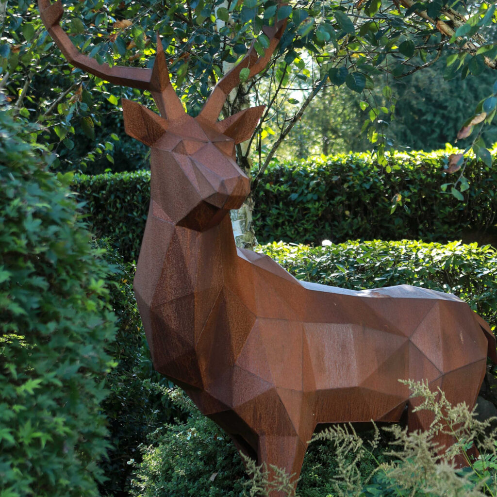 Geometric corten steel deer sculpture in a prestige outdoor setting